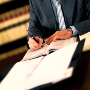 Lawyer writing | Savoy Investigations